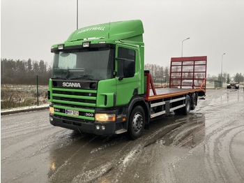 Autószállító teherautó a következők szállításához nehézgépek Scania 94: 1 kép.