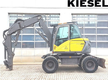 Gumikerekes kotró MECALAC