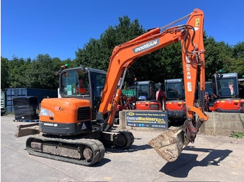 Minikotró Doosan DX 63-3: 3 kép. Minikotró Doosan DX 63-3: 3 kép.