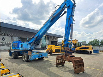 Hulladék kotró a következők szállításához hulladék Fuchs MHL 335: 2 kép. Hulladék kotró a következők szállításához hulladék Fuchs MHL 335: 2 kép.