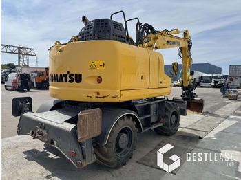Gumikerekes kotró Komatsu PW148-11: 3 kép.