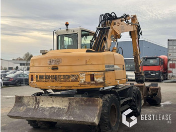 Gumikerekes kotró Liebherr A312 Litronic: 3 kép. Gumikerekes kotró Liebherr A312 Litronic: 3 kép.