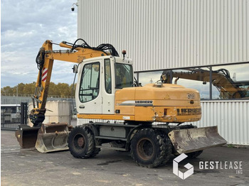 Gumikerekes kotró Liebherr A312 Litronic: 2 kép. Gumikerekes kotró Liebherr A312 Litronic: 2 kép.