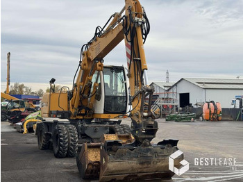 Gumikerekes kotró Liebherr A312 Litronic: 4 kép. Gumikerekes kotró Liebherr A312 Litronic: 4 kép.