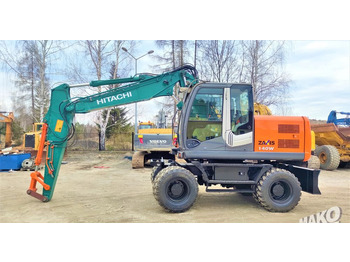 Gumikerekes kotró HITACHI ZX140W-3