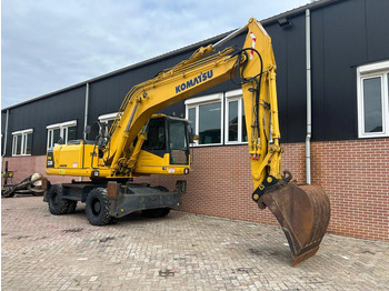 Gumikerekes kotró Komatsu PW200: 3 kép.