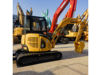 Minikotró Komatsu PC55MR: 5 kép.