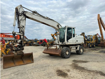 Gumikerekes kotró CATERPILLAR M316D