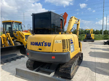 Minikotró KOMATSU PC56-7: 3 kép. Minikotró KOMATSU PC56-7: 3 kép.