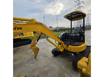 Minikotró Komatsu PC35MR: 3 kép.