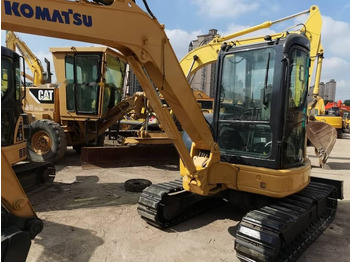 Minikotró Komatsu PC35MR: 5 kép.