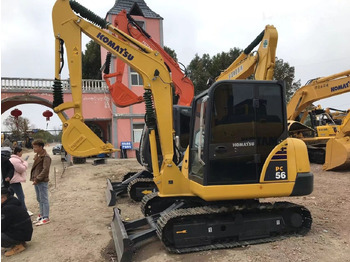 Minikotró Komatsu PC56: 5 kép.