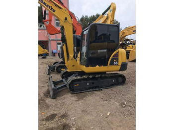 Minikotró Komatsu PC56: 4 kép.