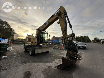 Gumikerekes kotró CAT M 317: 4 kép.