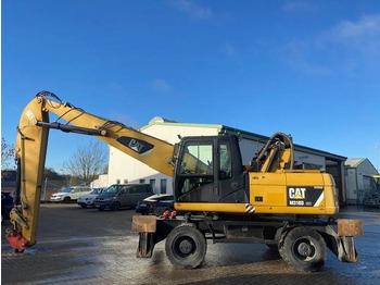 Hulladék kotró a következők szállításához hulladék Cat M 318 D MH (12005607): 2 kép. Hulladék kotró a következők szállításához hulladék Cat M 318 D MH (12005607): 2 kép.