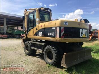 Gumikerekes kotró Caterpillar m 315c: 4 kép. Gumikerekes kotró Caterpillar m 315c: 4 kép.