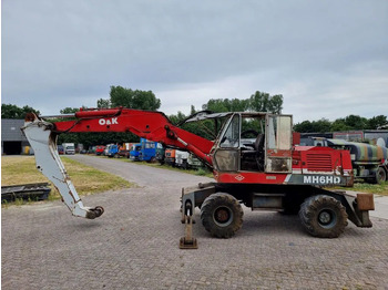 Gumikerekes kotró O&K