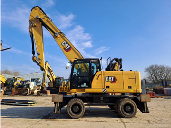 Gumikerekes kotró CATERPILLAR MH3024