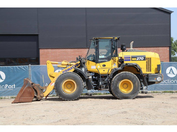 Gumikerekes homlokrakodó Komatsu WA270-8E0: 2 kép. Gumikerekes homlokrakodó Komatsu WA270-8E0: 2 kép.