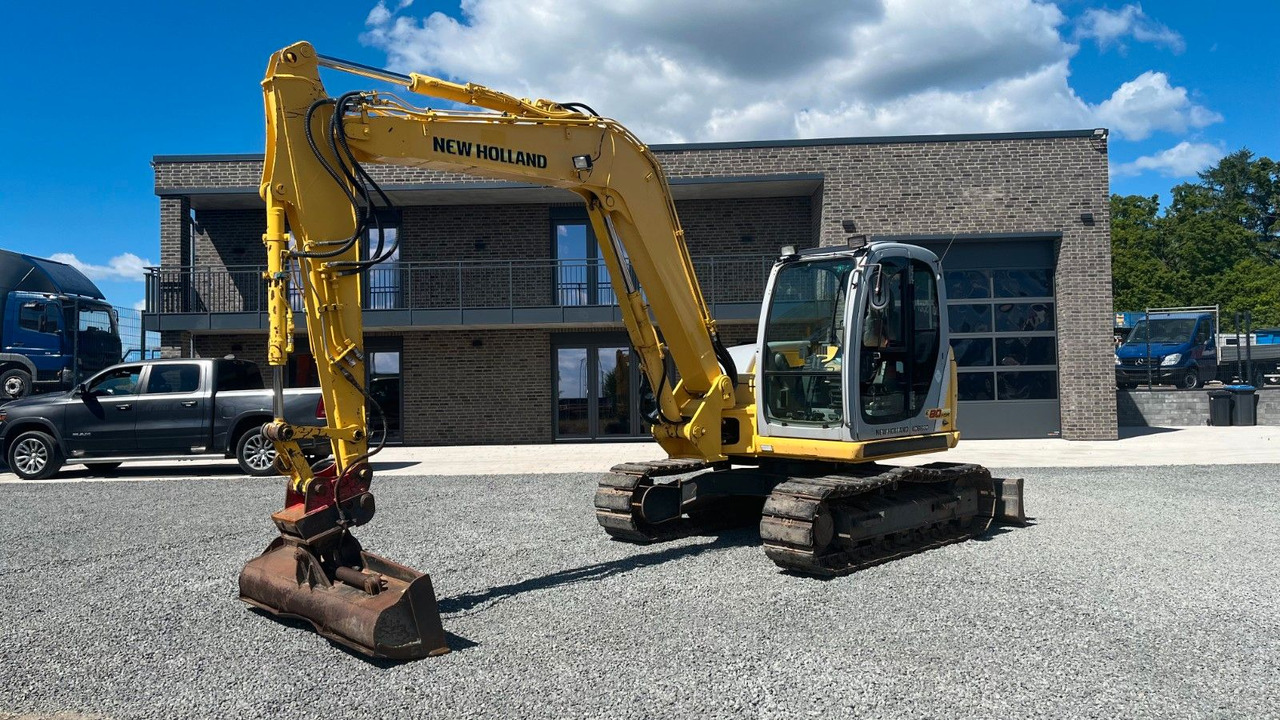 New Holland Kobelco E 80 MSR Minibagger SW 8300 Kg - Minikotró: 2 kép. New Holland Kobelco E 80 MSR Minibagger SW 8300 Kg - Minikotró: 2 kép.