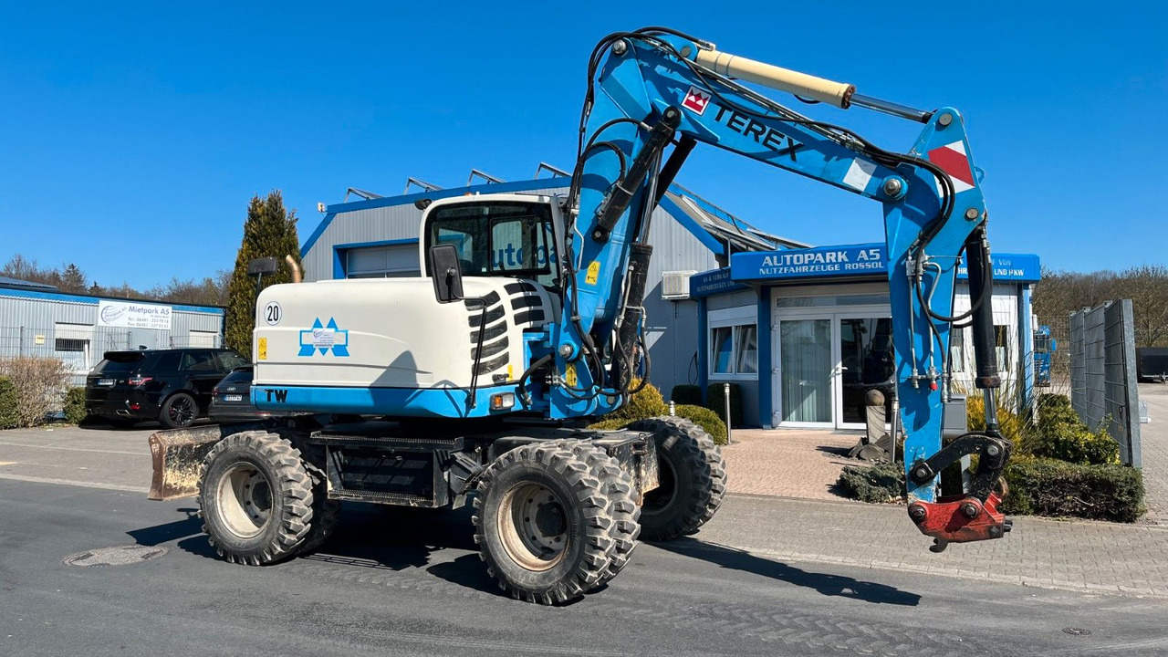 Terex TW110 Mobilbagger Verstellausleger 11000Kg - Gumikerekes kotró: 1 kép. Terex TW110 Mobilbagger Verstellausleger 11000Kg - Gumikerekes kotró: 1 kép.