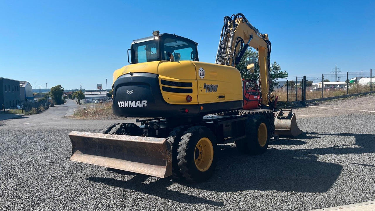 Yanmar B110W Mobilbagger Rotortilt Klima 4x Löffel - Gumikerekes kotró: 4 kép. Yanmar B110W Mobilbagger Rotortilt Klima 4x Löffel - Gumikerekes kotró: 4 kép.