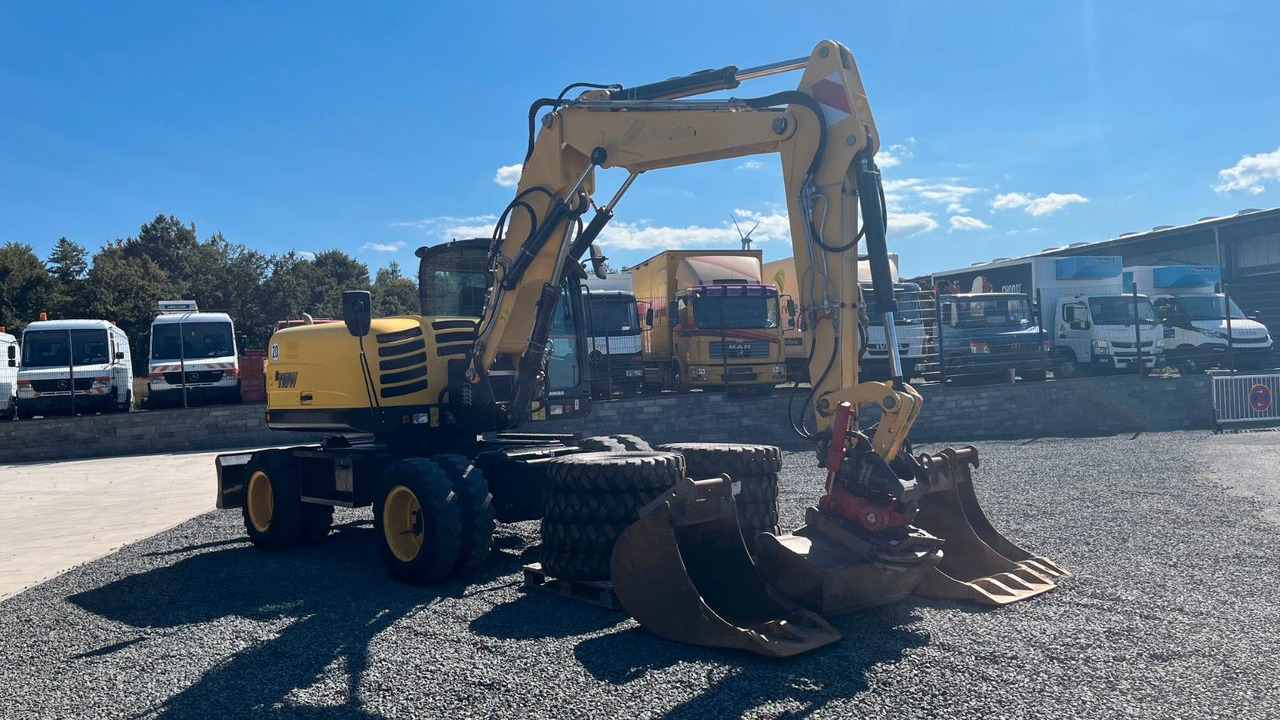 Yanmar B110W Mobilbagger Rotortilt Klima 4x Löffel - Gumikerekes kotró: 3 kép. Yanmar B110W Mobilbagger Rotortilt Klima 4x Löffel - Gumikerekes kotró: 3 kép.