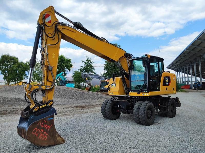 Caterpillar M316F - Gumikerekes kotró: 2 kép. Caterpillar M316F - Gumikerekes kotró: 2 kép.
