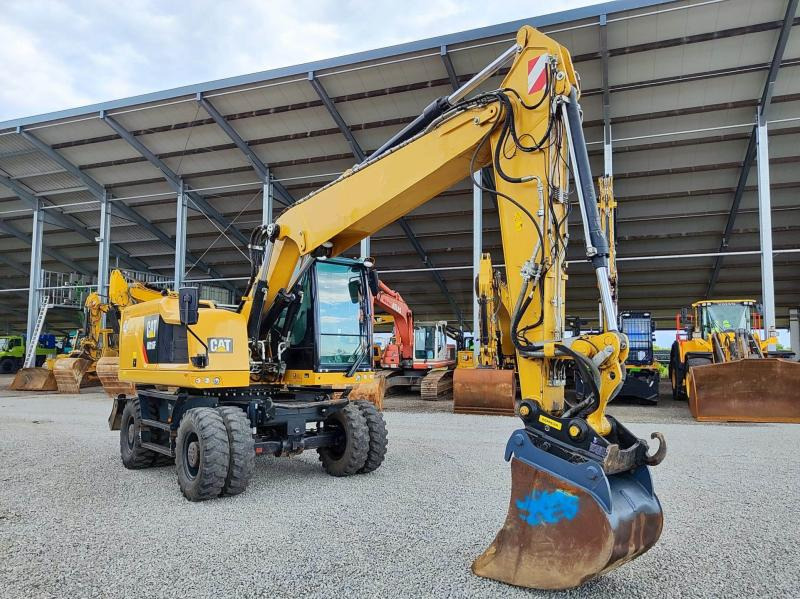 Caterpillar M316F - Gumikerekes kotró: 3 kép. Caterpillar M316F - Gumikerekes kotró: 3 kép.