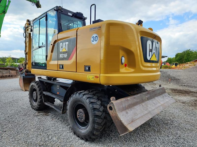 Caterpillar M316F - Gumikerekes kotró: 1 kép. Caterpillar M316F - Gumikerekes kotró: 1 kép.