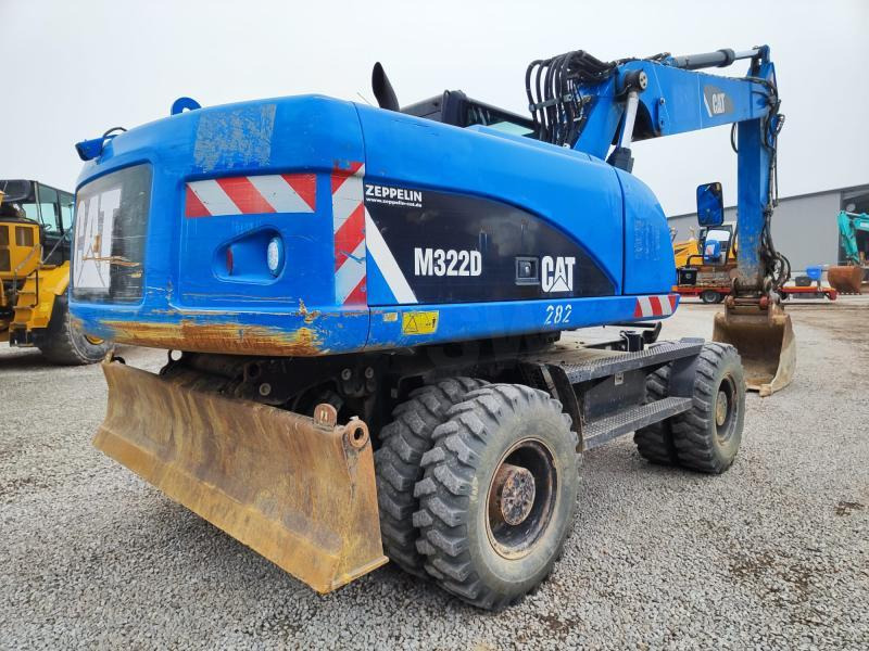 Caterpillar M322D VAH - Gumikerekes kotró: 4 kép. Caterpillar M322D VAH - Gumikerekes kotró: 4 kép.