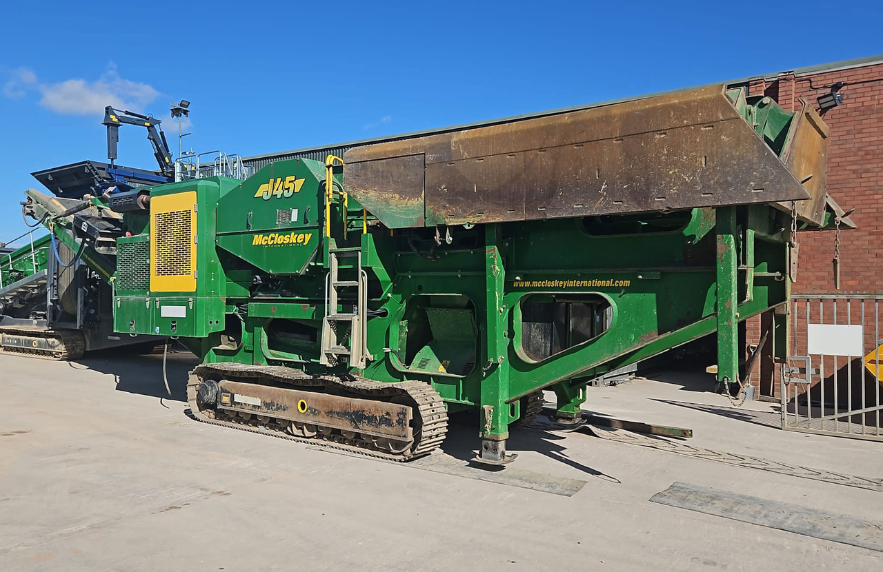 McCloskey J45 - Pofás törő: 2 kép. McCloskey J45 - Pofás törő: 2 kép.