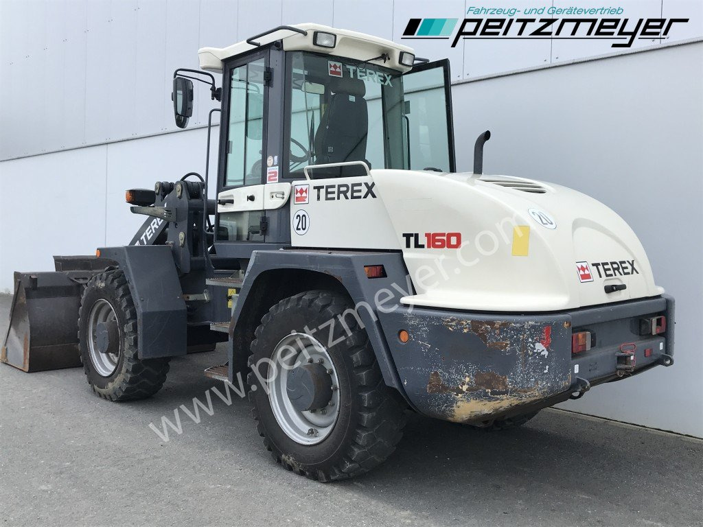 TEREX Radlader TL 160 Schaufel + Gabel - Gumikerekes homlokrakodó: 3 kép. TEREX Radlader TL 160 Schaufel + Gabel - Gumikerekes homlokrakodó: 3 kép.