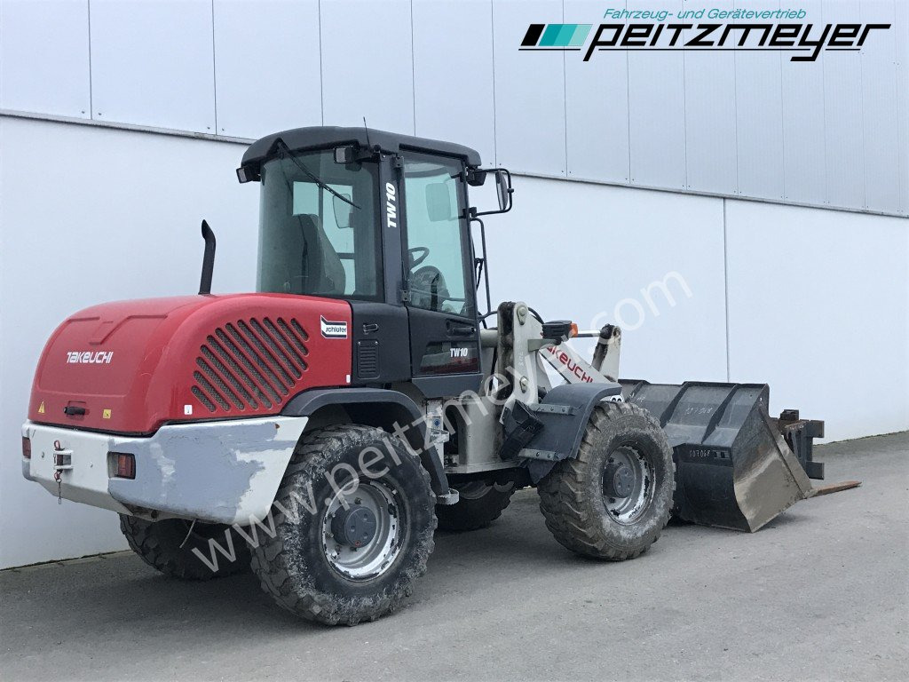 Takeuchi / Terex Radlader TW 10 (ohne Ad-Blue) - Gumikerekes homlokrakodó: 4 kép. Takeuchi / Terex Radlader TW 10 (ohne Ad-Blue) - Gumikerekes homlokrakodó: 4 kép.