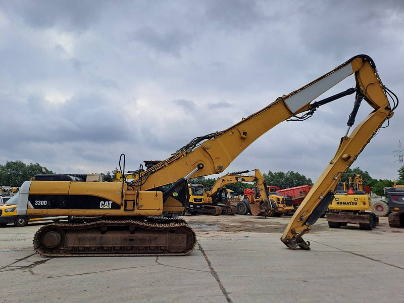 Cat 330DL UHD - Lánctalpas kotró: 5 kép. Cat 330DL UHD - Lánctalpas kotró: 5 kép.