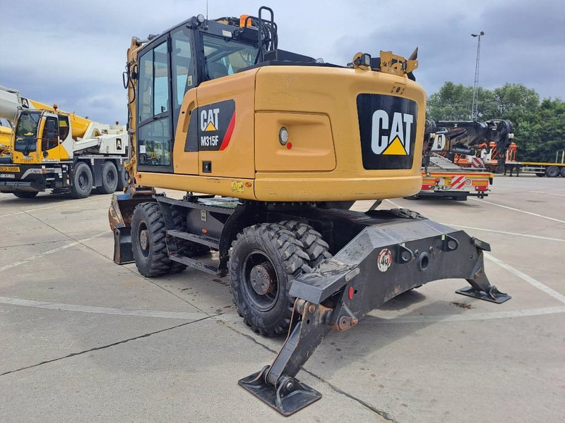 Cat M 315 F - Gumikerekes kotró: 2 kép. Cat M 315 F - Gumikerekes kotró: 2 kép.
