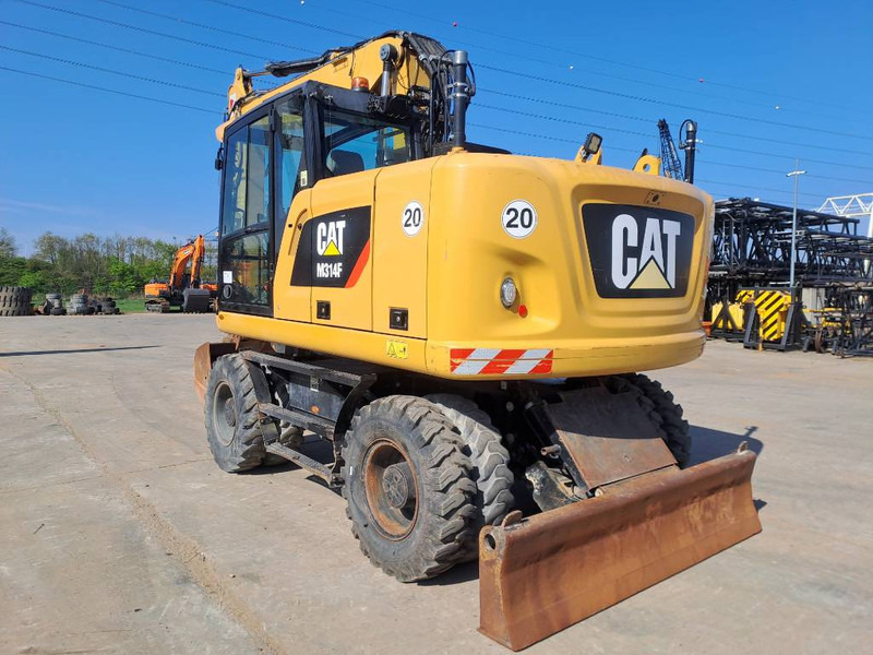 Cat M314F - Gumikerekes kotró: 2 kép. Cat M314F - Gumikerekes kotró: 2 kép.