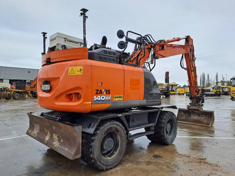 Hitachi ZX140WTB-6 (Topcon GPS + Engcon) - Gumikerekes kotró: 4 kép. Hitachi ZX140WTB-6 (Topcon GPS + Engcon) - Gumikerekes kotró: 4 kép.