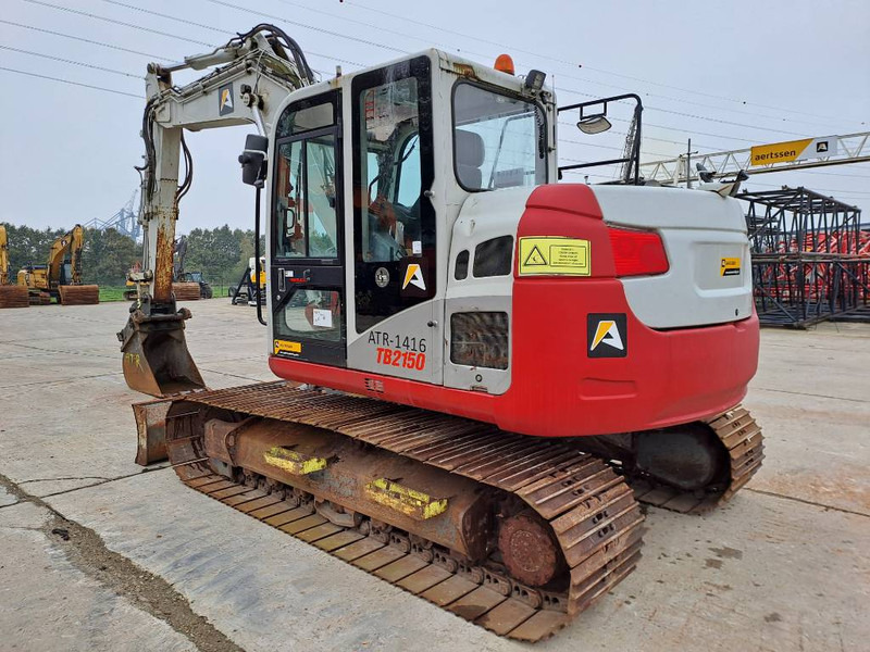 Takeuchi TB2150 - Lánctalpas kotró: 2 kép. Takeuchi TB2150 - Lánctalpas kotró: 2 kép.