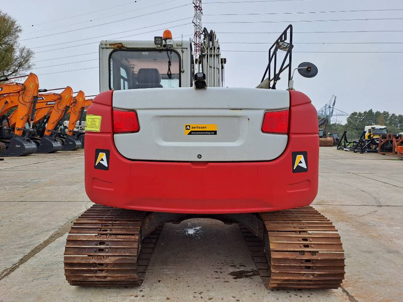 Takeuchi TB2150 - Lánctalpas kotró: 3 kép. Takeuchi TB2150 - Lánctalpas kotró: 3 kép.