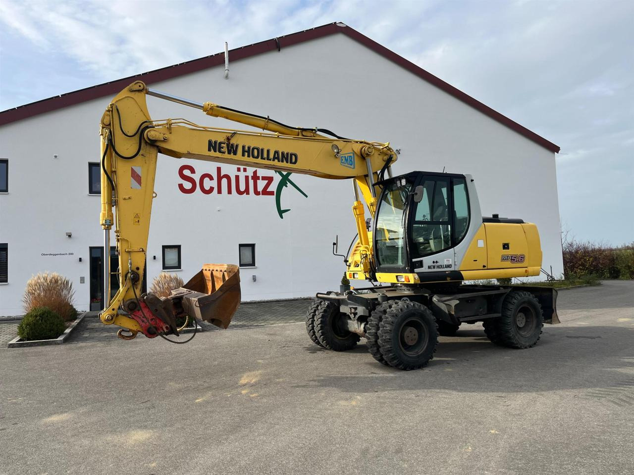 New Holland MH 5.6 inkl. Grabenlöffel, Tieflöffel - Gumikerekes kotró: 2 kép. New Holland MH 5.6 inkl. Grabenlöffel, Tieflöffel - Gumikerekes kotró: 2 kép.