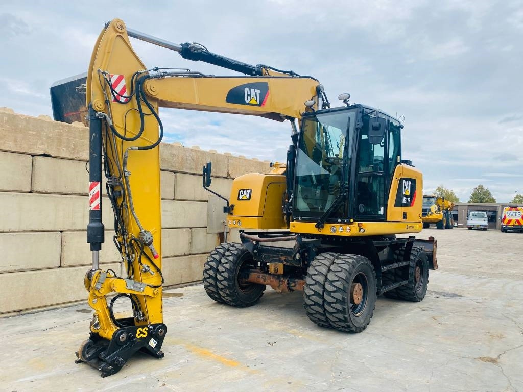 CAT m317f - Gumikerekes kotró: 4 kép. CAT m317f - Gumikerekes kotró: 4 kép.