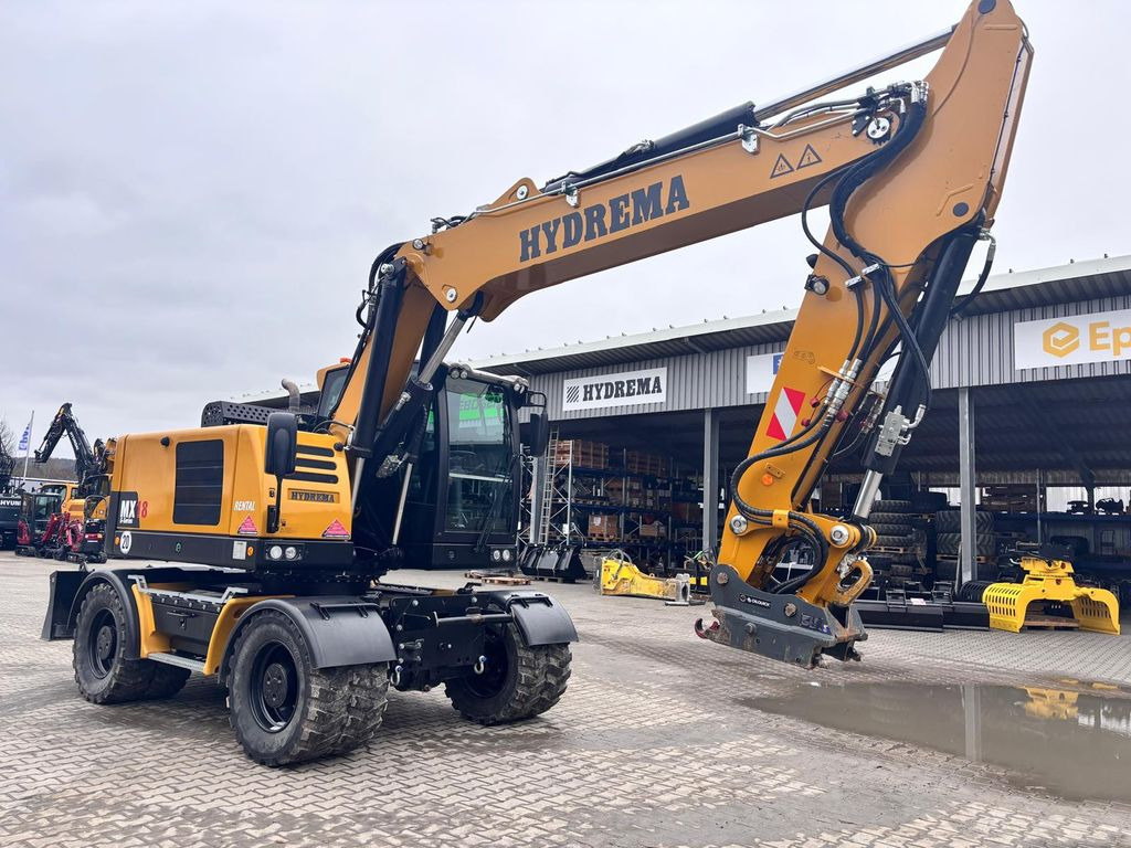 Hydrema MX18G Hydrema MX18G - Gumikerekes kotró: 2 kép. Hydrema MX18G Hydrema MX18G - Gumikerekes kotró: 2 kép.