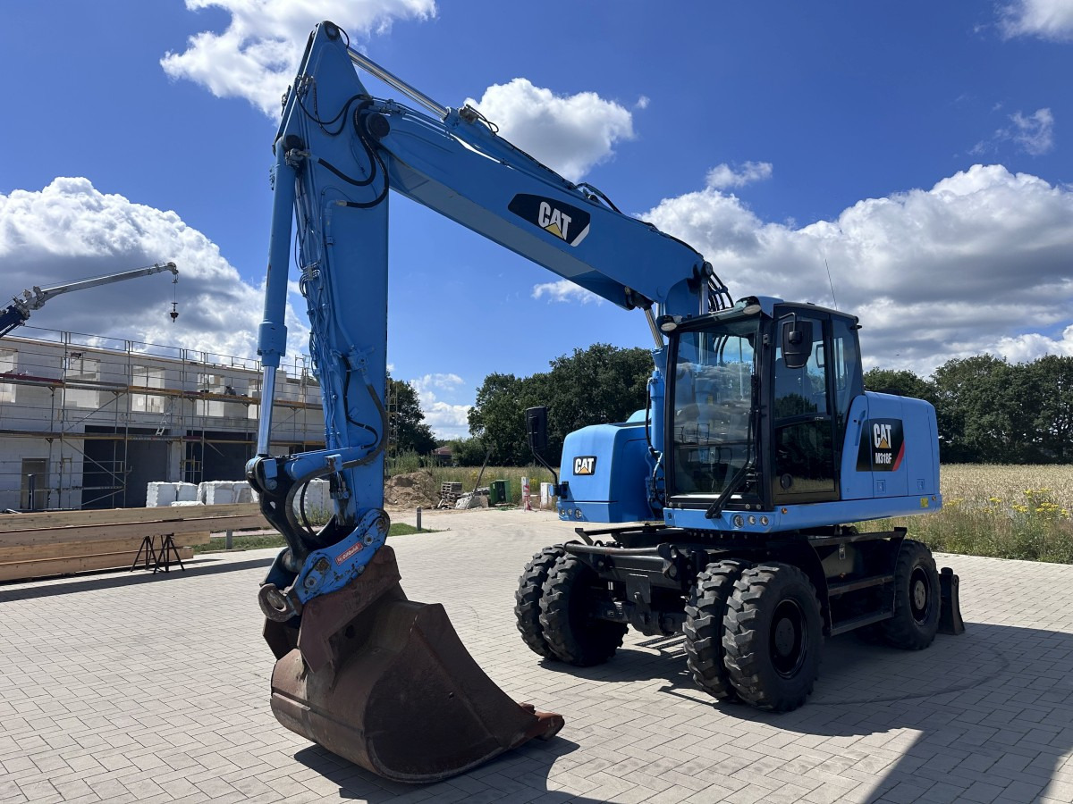 CATERPILLAR M 318 F Oil Quick OQ 65 Deutsche Maschine Top ! - Gumikerekes kotró: 3 kép. CATERPILLAR M 318 F Oil Quick OQ 65 Deutsche Maschine Top ! - Gumikerekes kotró: 3 kép.