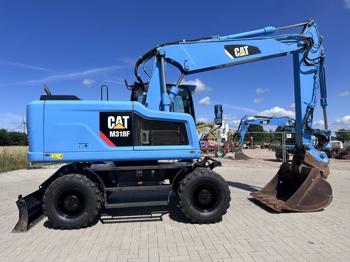 CATERPILLAR M 318 F Oil Quick OQ 65 Deutsche Maschine Top ! - Gumikerekes kotró: 2 kép. CATERPILLAR M 318 F Oil Quick OQ 65 Deutsche Maschine Top ! - Gumikerekes kotró: 2 kép.
