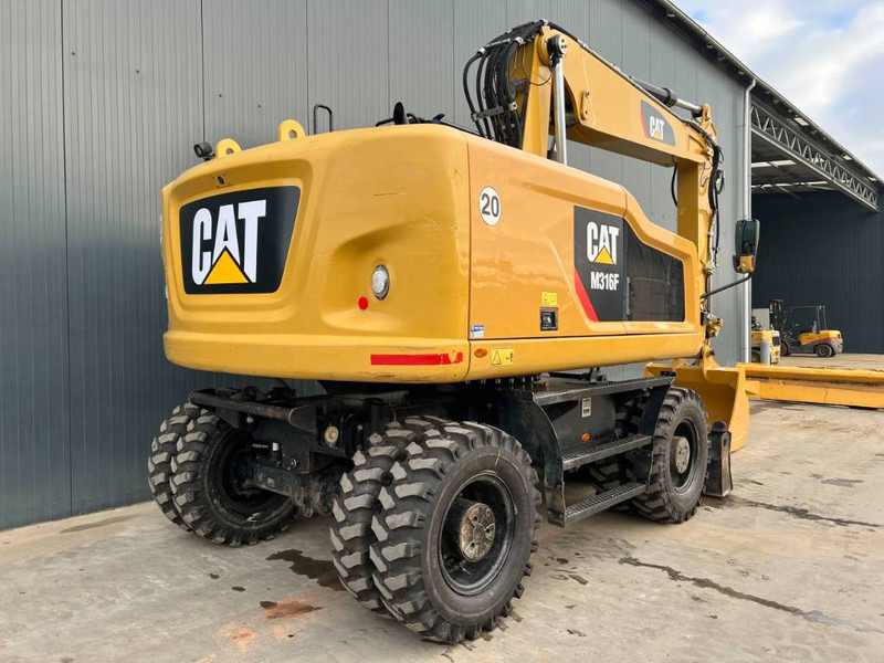 Cat M316F - Gumikerekes kotró: 4 kép. Cat M316F - Gumikerekes kotró: 4 kép.