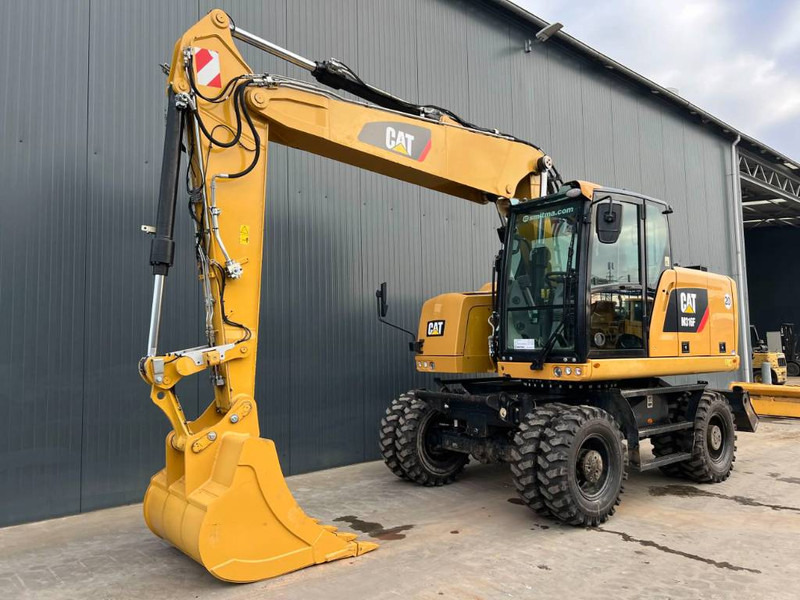 Cat M316F - Gumikerekes kotró: 1 kép. Cat M316F - Gumikerekes kotró: 1 kép.