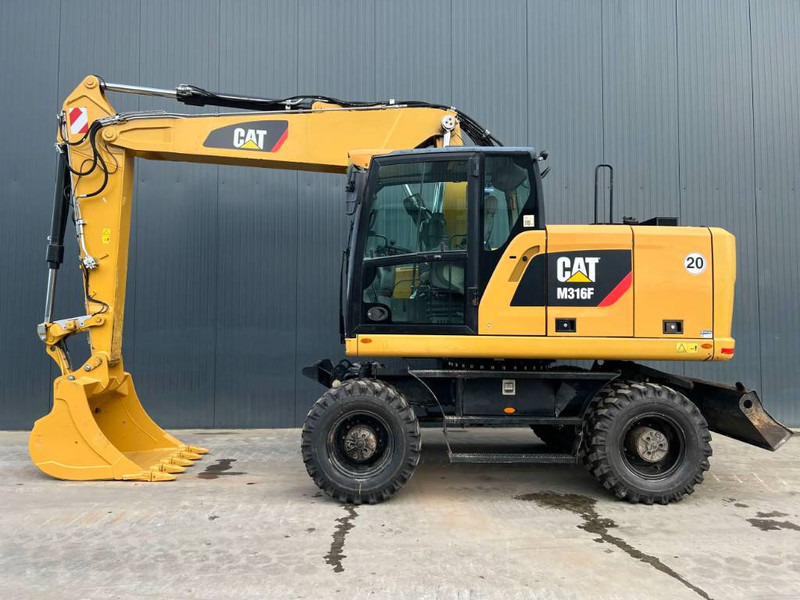 Cat M316F - Gumikerekes kotró: 5 kép. Cat M316F - Gumikerekes kotró: 5 kép.