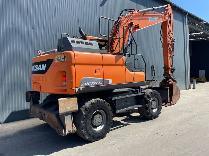 Doosan DX170W-5 - Gumikerekes kotró: 4 kép. Doosan DX170W-5 - Gumikerekes kotró: 4 kép.