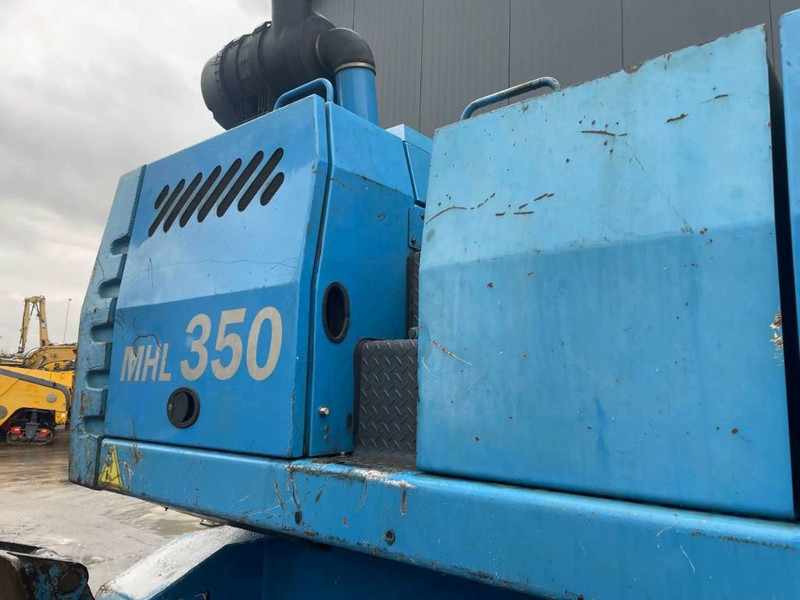 Hulladék kotró a következők szállításához hulladék Fuchs MHL350: 8 kép.